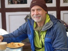 Alan enjoying apple pie in Namche in 2011