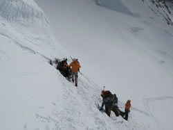 Climbing the fixed ropes on the headwall - click to enlarge.