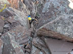 One of the more difficult moves climbing the North Peak from the Traverse (63kb)