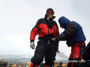 Sherpa helping returning climber